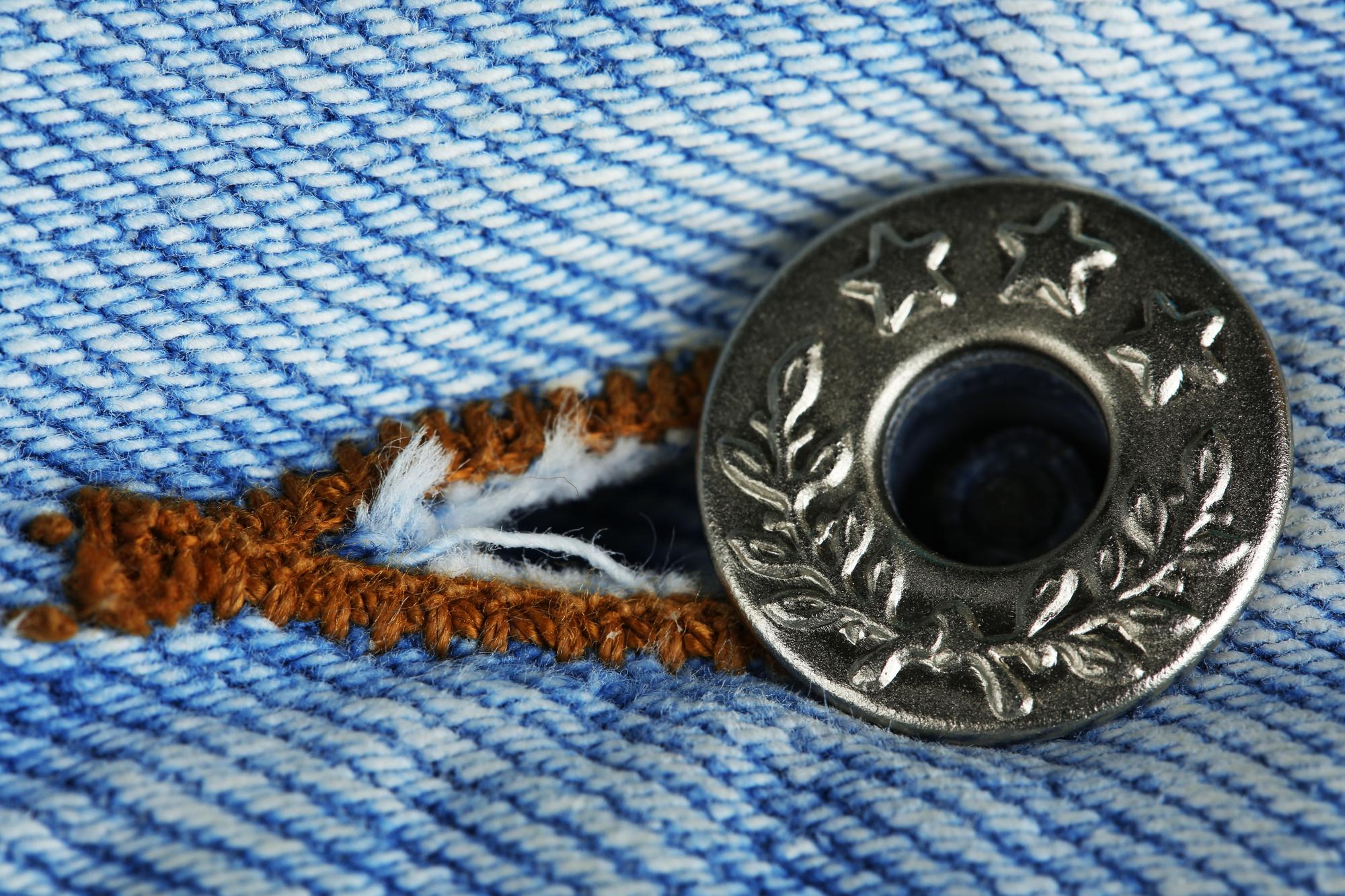 Close up of embroidered crest on denim